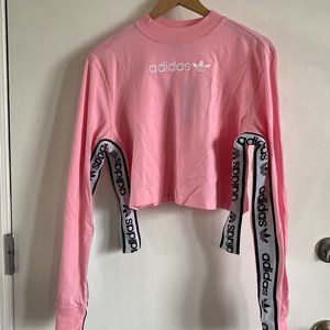 pink cropped adidas tape long sleeve tshirt
